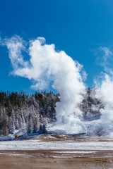 Colorful Porcelain Basin area trail with steaming vents and fumaroles in Yellowstone National Park, Wyoming, USA
