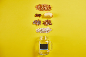 Bowl with tasty granola and ingredients on color background