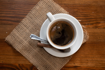 cup of coffee on wooden table