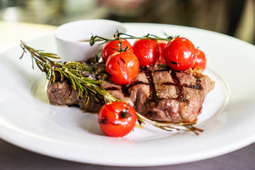 meat; steak; grill; grilled; bbq; barbeque; food; meal; butter; food, meal, plate, sauce, rosemary; cooking; picnic; stripes; veal; beef; party; chef; kitchen; restaurant