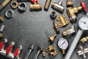 Plumbing equipment on gray flat lay background with copy space.