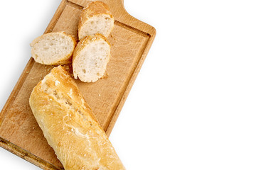 French lunch, breakfast baguette, Fresh natural French baguette, natural wooden cutting board, morning pastries from the bakery, delicate baguette, golden crust