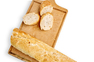French lunch, breakfast baguette, Fresh natural French baguette, natural wooden cutting board, morning pastries from the bakery, delicate baguette, golden crust