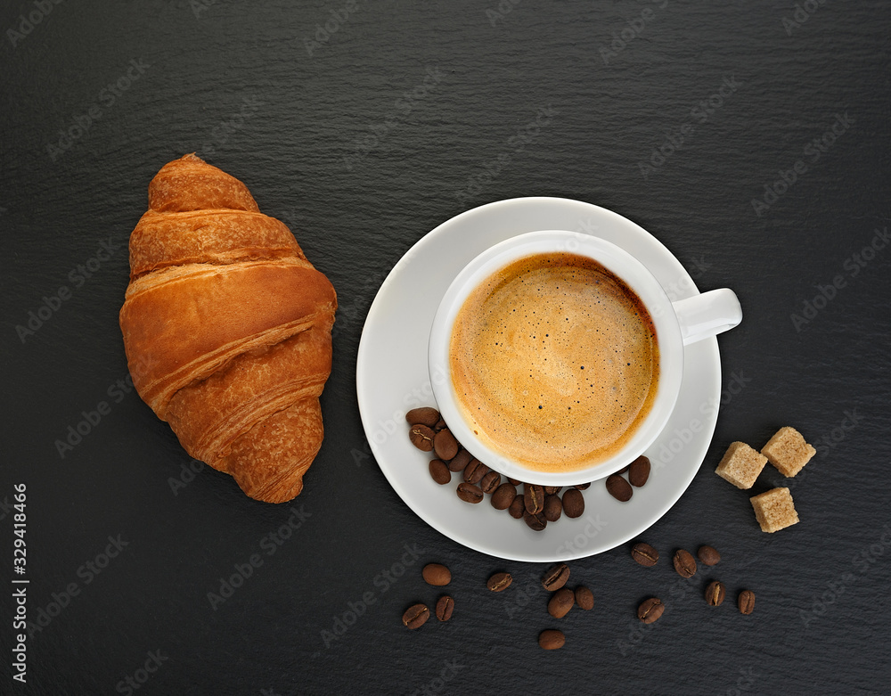 Wall mural white cup with coffee and coffee grains cookies on black slate blackboard