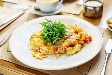 omelette with arugula salad, breakfast in the cafe