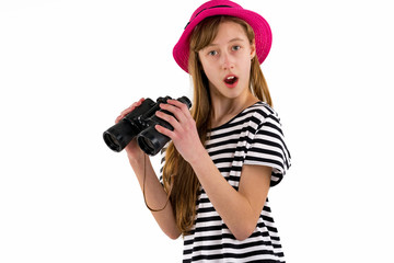 Young brunette girl wering trendy clothes with binoculars on white isolated background.Copy space,mock up banner.Summer concept.