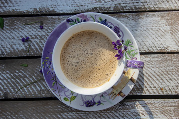 violet cappuccino in a lilac cup
