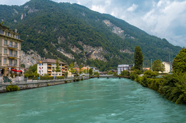 Fototapeta na wymiar Beautiful landscape photo of River Aare with turqouise water in Interlaken, Switzerland