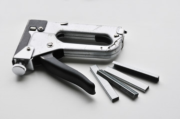 The industrial stapler isolated on white background