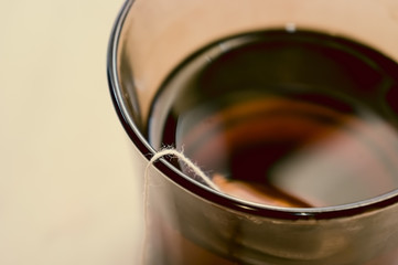 Rope from a tea bag in a cup of tea