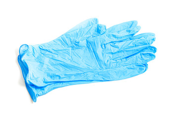 Disposable rubber medical gloves. Protective subjects. Remedies. A pair of thin blue medical latex gloves on a white background.