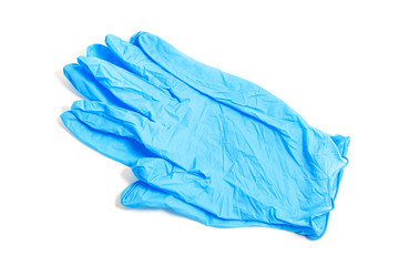 A pair of thin blue medical latex gloves on a white background.