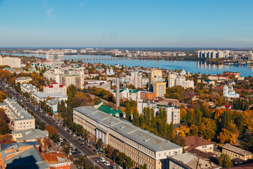 Obraz premium Sunny golden autumn Voronezh. Aerial view from skyscraper roof height to Revolution prospect - central street of Voronezh