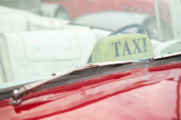 Detail of a red taxi in Cuba