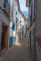 Colorful street with old buildings in Chelva, valencian community, Spain