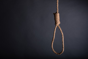 Close-up of a hang noose rope on grey background in studio - 329424437