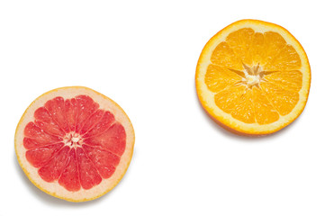 Slices of orange and red grapefruit isolated on white