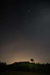 Fototapeta na wymiar In the mountains at night. Constellations in the starry night.
