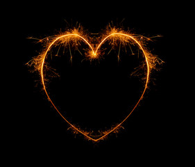 heart, written with a sparkler on a black background
