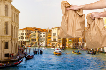 food delivery in paper bags against the background of Italy