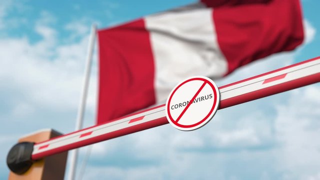 Closing boom barrier with STOP CORONAVIRUS sign against the Peruvian flag. Quarantine in Peru