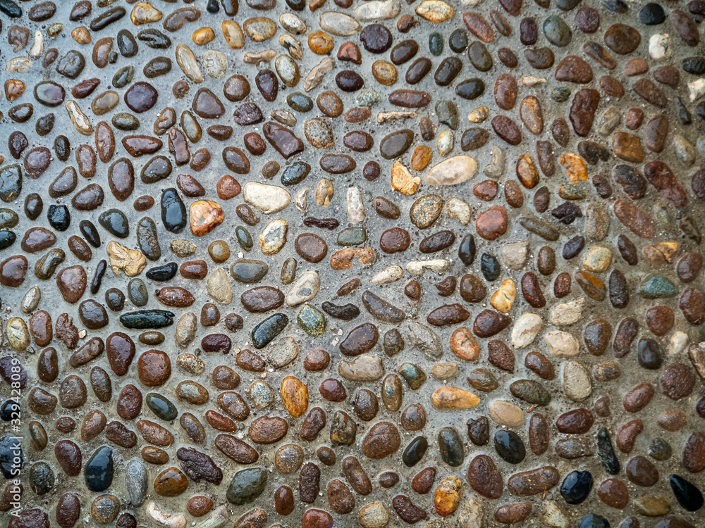 Poster the pavement is paved with stones of approximately the same size. a multi-colored pattern of small s