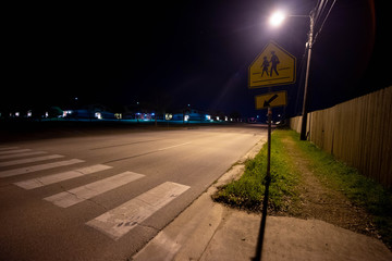 crosswalk sign at night
