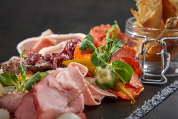 meat appetizers on the black background