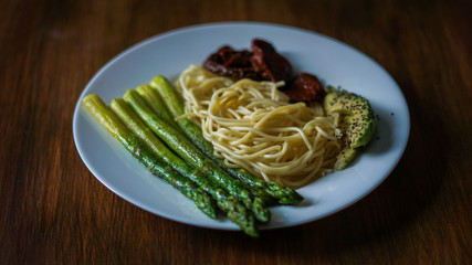 Pasta,dried tomatoes, asparagus, avocado and chia seed