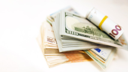 Pack of money from different countries on the table. Dollars, euros, hryvnias, Russian rubles, exchange rate. Business and finance. Currency confrontation on world market.