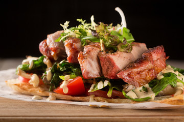 Pork barbecue with spinach, tomatoes and mushrooms on toast