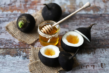 Black radish. Black radish with honey. Natural cure for colds and coughs. Healthy recipes concept....