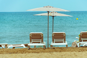 Hammocks and umbrellas on a beach in Alicante. Spain