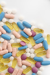 Macro shot of different pills and vitamins on white background. High resolution, isolated