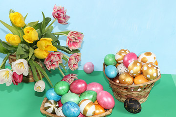 Decorated golden easter eggs on trendy green background. Minimal holiday concept. Happy Easter background, place for text, postcard, banner for the screen.