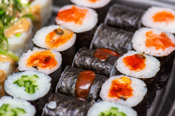 Variety of sushi food. Top view. Traditional asian food with raw fish and rice. Sushi rolls set