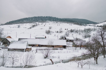 Winter village landscape in mountains