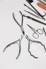 Professional manicure and pedicure instruments. Ready-made template on the theme of tools for edged, hardware, European, combined manicure.