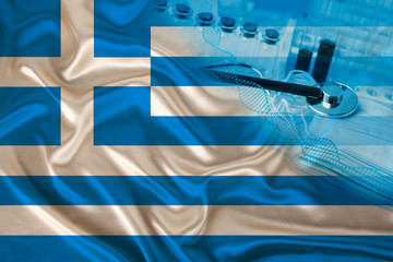 medical test tubes, stethoscope in the corner of the silk national flag of the state of Greece, concept of medicine, coronavirus, SARS, COVID-19