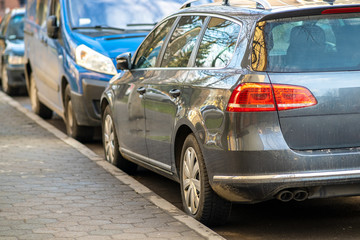 Kyiv, Ukraine - February 16, 2020: Modern cars parked on city street side in residential discrict. Shiny vehicles parked by the curb. Urban transportation infrastructure concept.