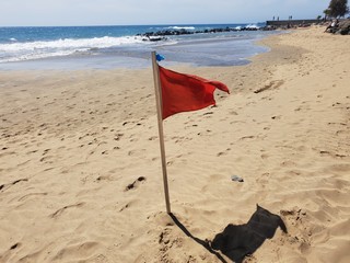 red flag on the beach