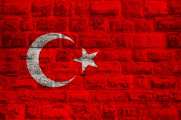 national flag of modern state of Turkey on an old historical stone wall, concept of business,...