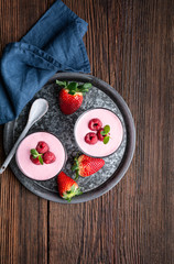 Healthy drink, strawberry and raspberry smoothie with Greek yogurt in a glass jar