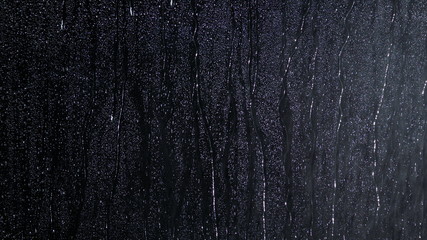 Black wet background raindrops for overlaying on window, concept of autumn weather, background of...