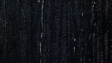 A lot of raindrops of white water falling down. Perfect for digital composing. Pure black background.