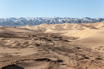 Gobi Desert Singing Sand Dunes mountain at background