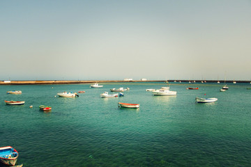  view of the wooden small boats standing in the harbor on the Spanish island of Lanzarote in the...