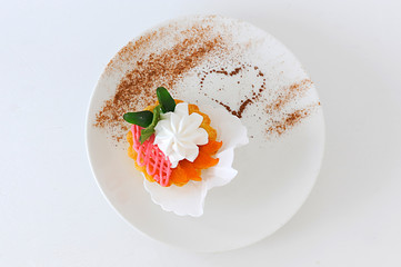 Cream dessert on white plate