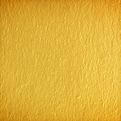 Obraz premium Gold paint on cement wall texture.