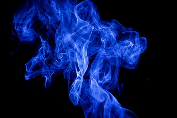 Blue smoke on black background